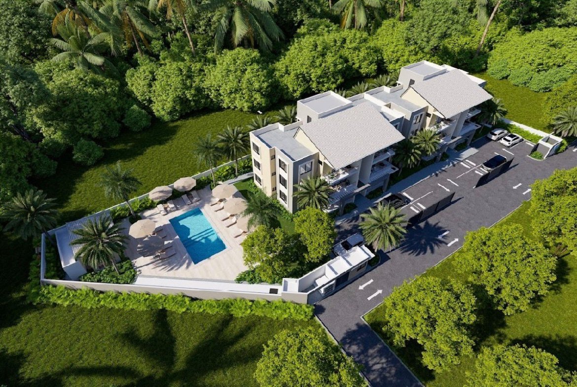 Vista aérea de complejo residencial con piscina