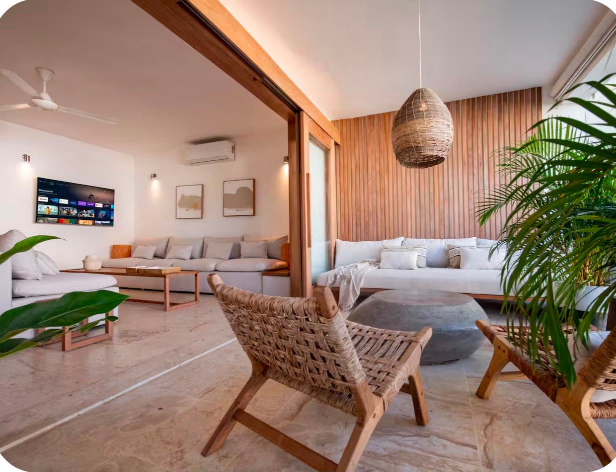 Apartamento A Popi (3) Salón moderno con muebles de madera y fibras naturales