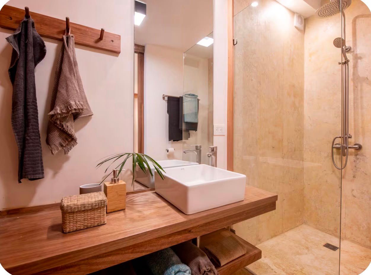 Apartamento A Popi (9) Baño moderno con ducha y lavabo sobre encimera