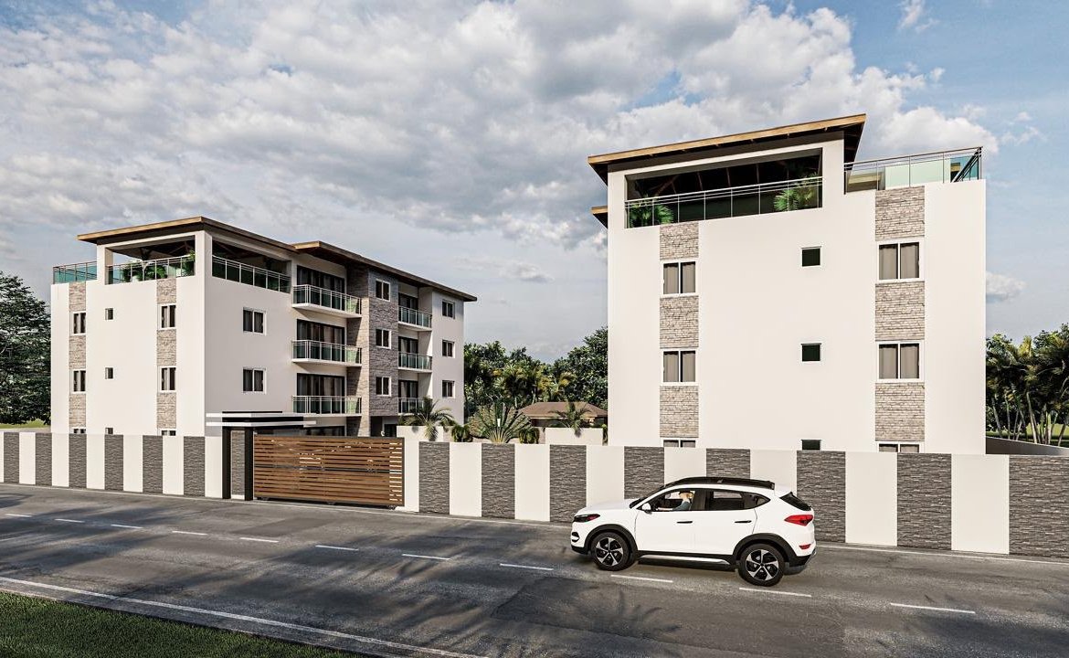 Edificios residenciales modernos con coche blanco delante
