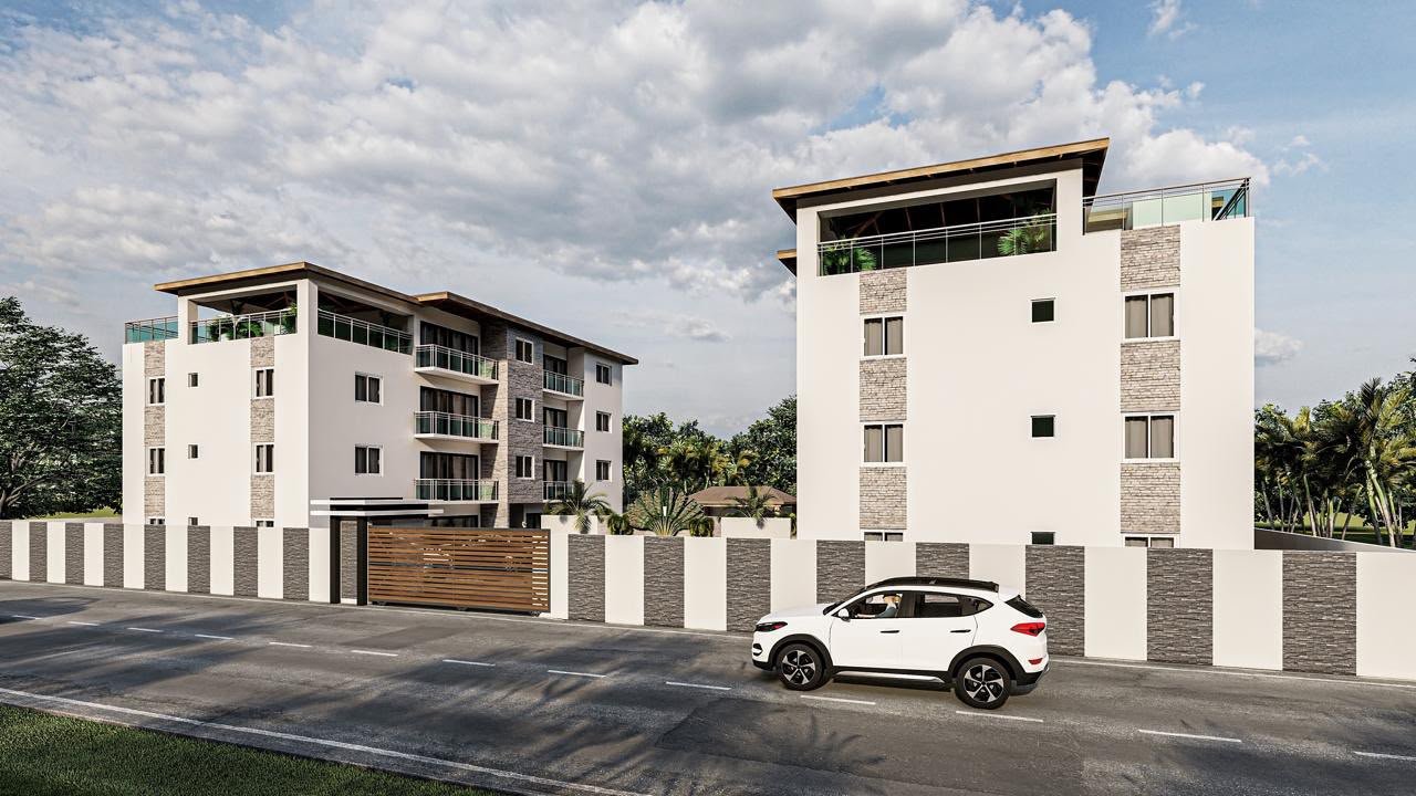 Edificios residenciales modernos con coche blanco delante